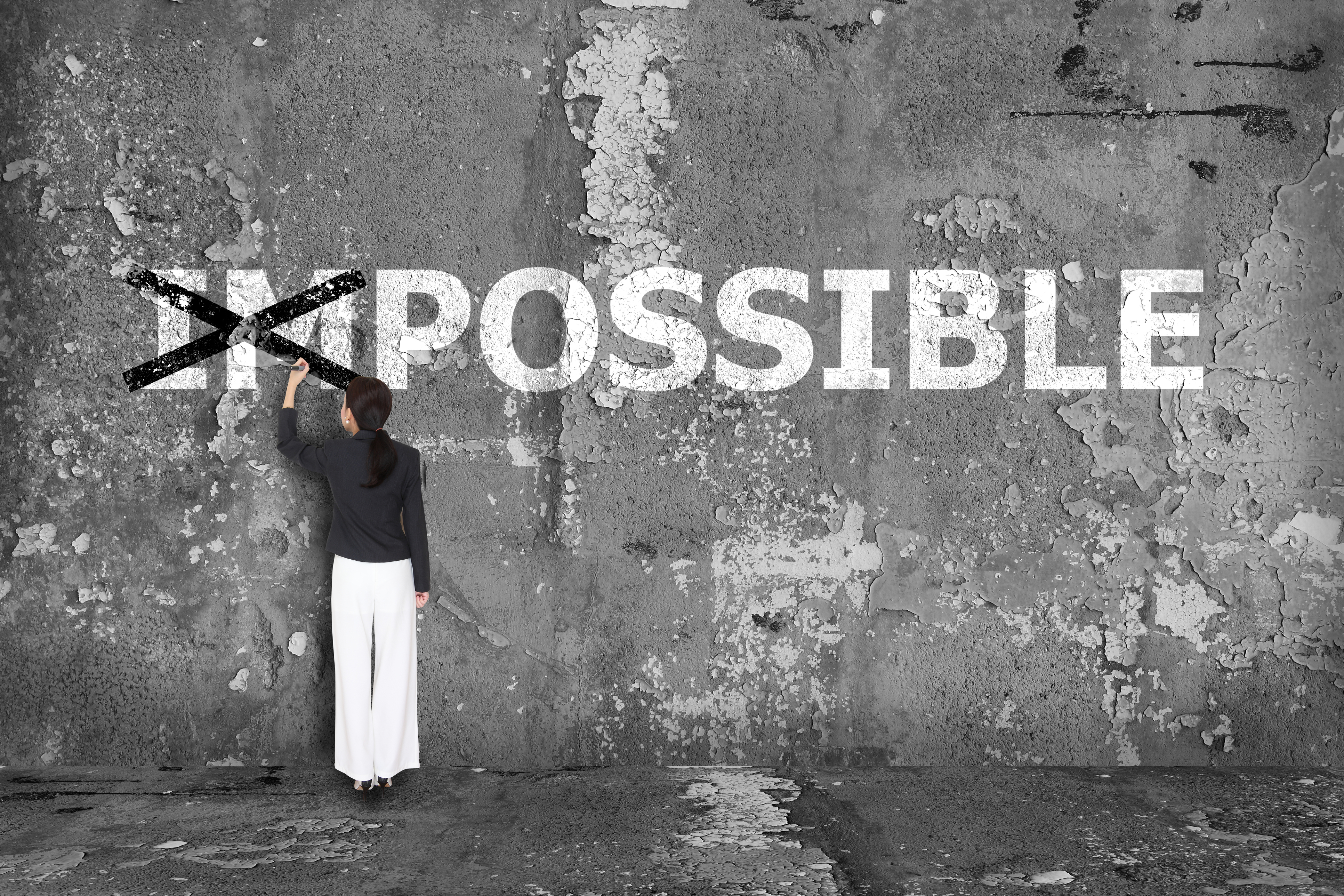 business-woman-drawing-possible-on-wall-523894793_3868x2578.jpeg